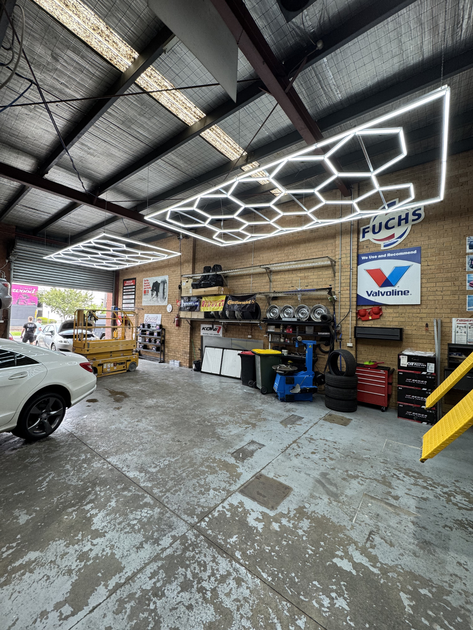 Hexagon LED lights in car showroom – Studio Hex Melbourne